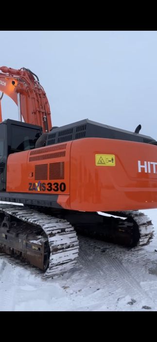 Экскаватор с вибропогружателем