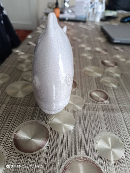 Стара статуетка на риба