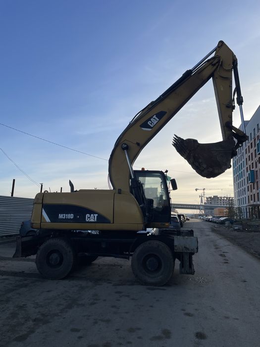 Продам колесный эксковатор CAT318