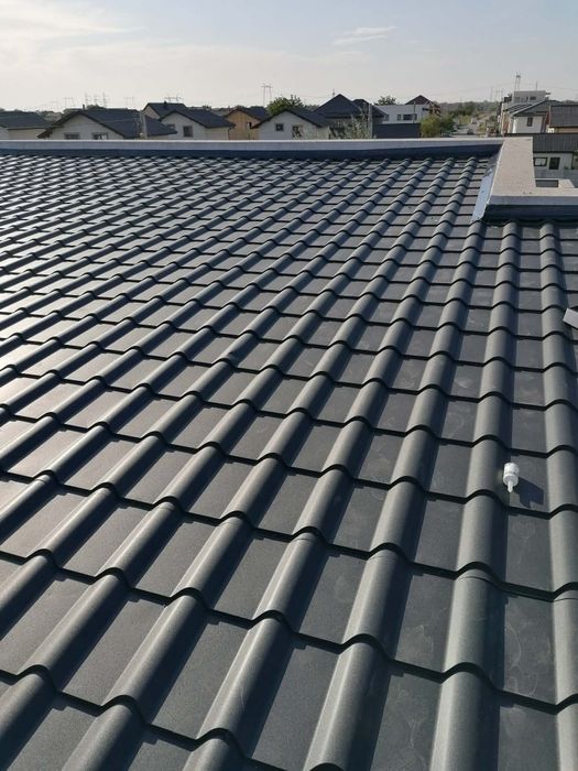 Reparatii acoperisuri tigla metalica velux