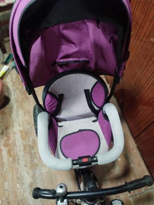 Детская коляска и трёхколёсный велик