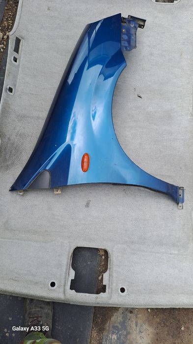 калник Nissan Almera Tino  2000-2006