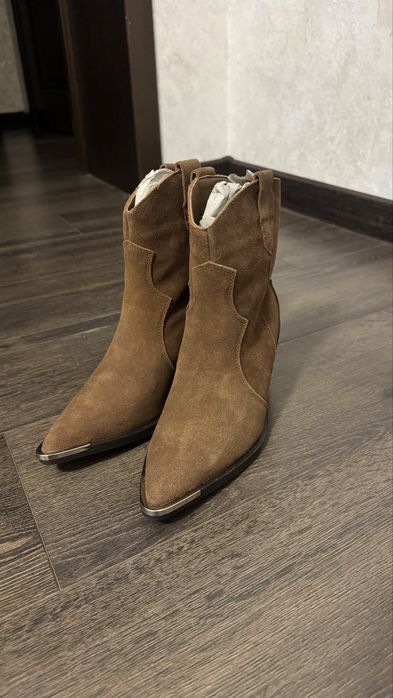 Продам новые сапоги