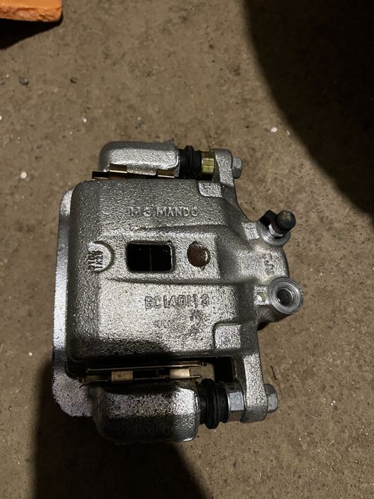 Суппорт задний левый SsangYong Kyron