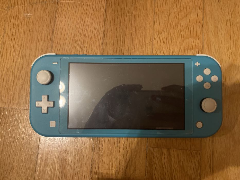 Nintendo switch lite + joycons + 128gb sd crad + Mariokart 8 Delux