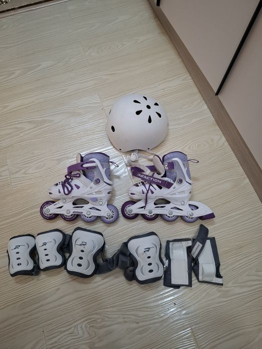 Роликовые коньки