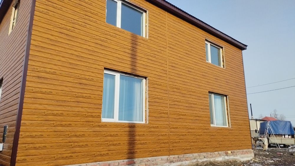 Обшивка фасада сайдингом, профлистом