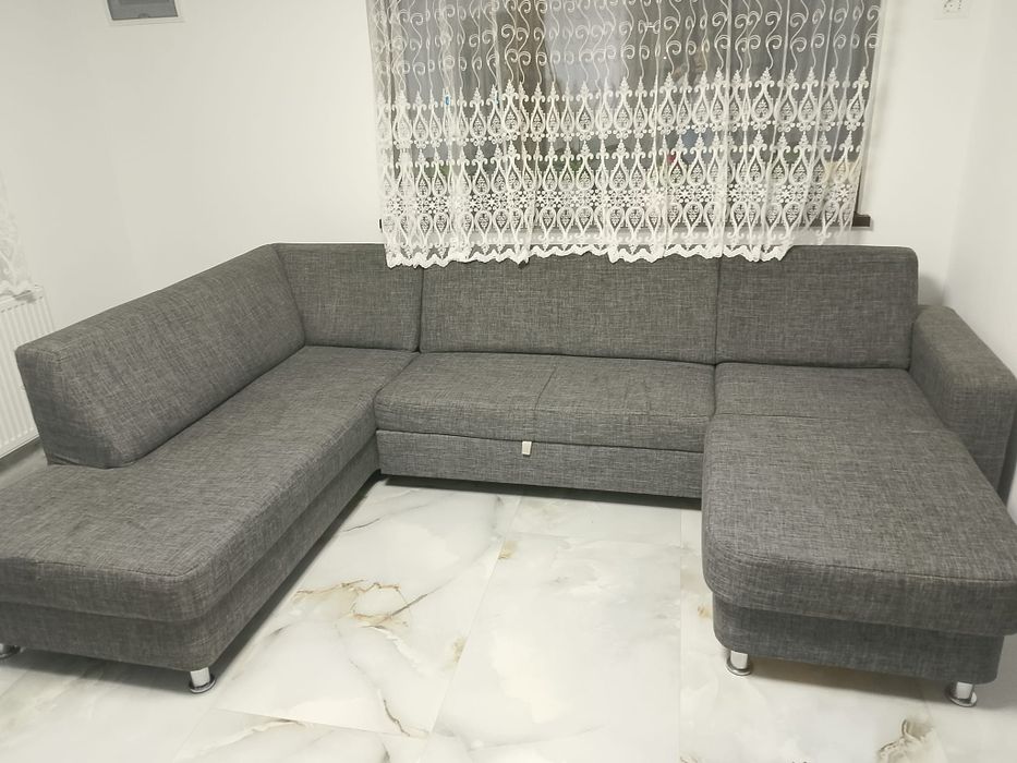 Vând colțar extensibil în forma U textil  gri. Saltea relaxa, stare foarte bună