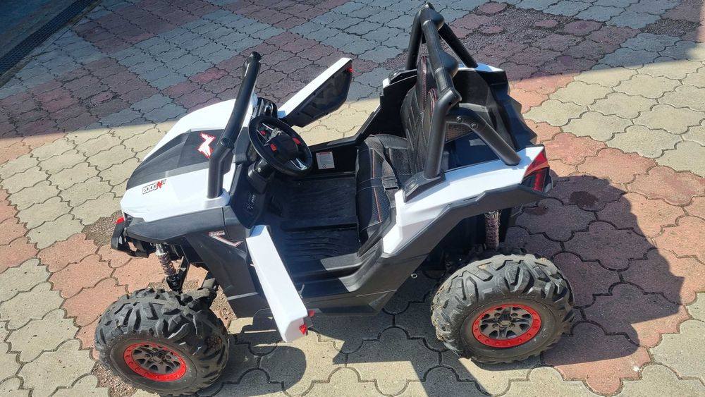 Masinuta electrica Xtreme Jumper UTV-MX White cu telecomanda 150W, doua locuri si roti Eva, unitate audio cu slot card si usb