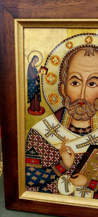 Icoană religioasă pictată pe sticlă.