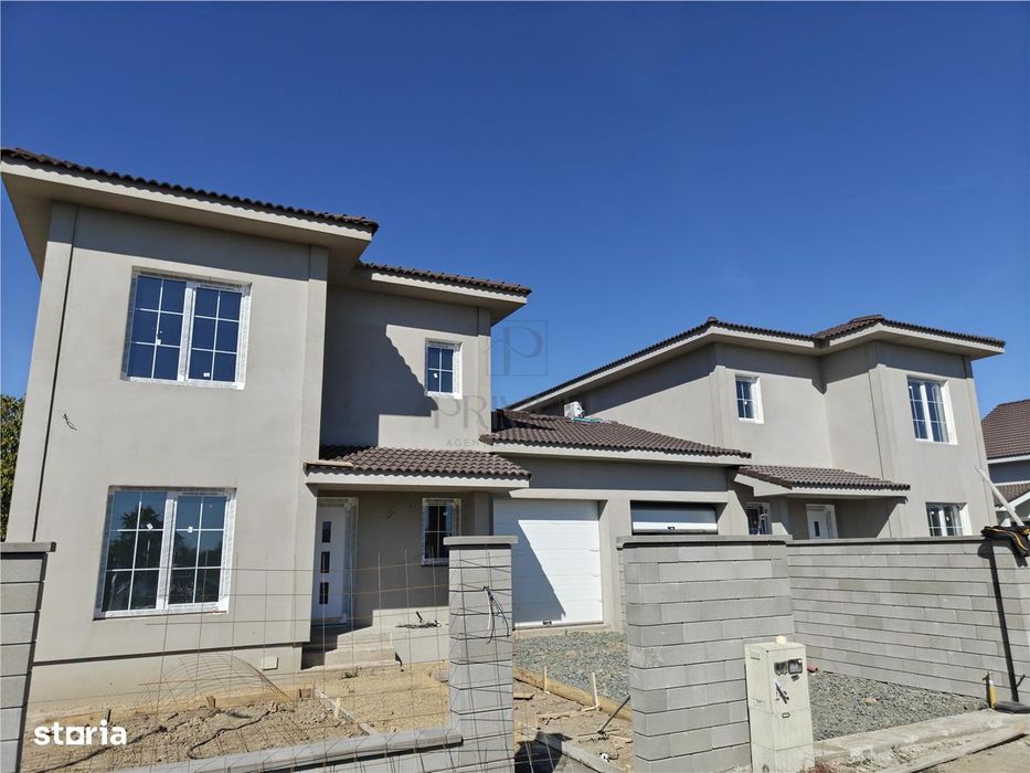 Duplex 5 camere - despartit prin garaj - teren generos