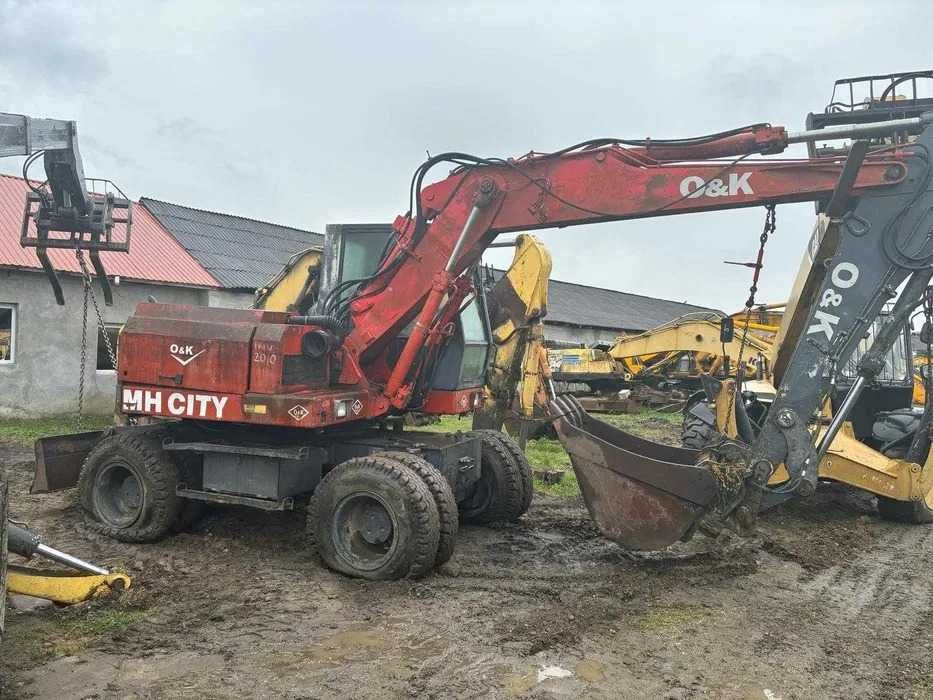 Dezmembrez excavator pe roti O&K MH CITY-piese de schimb O&K