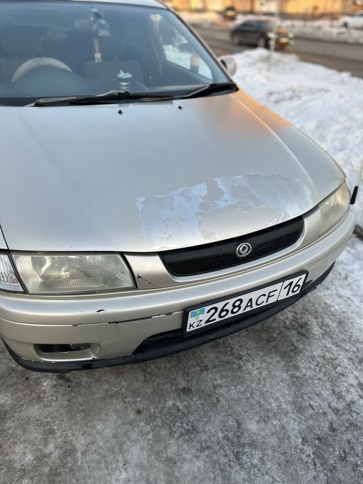 Продам машину mazda familia