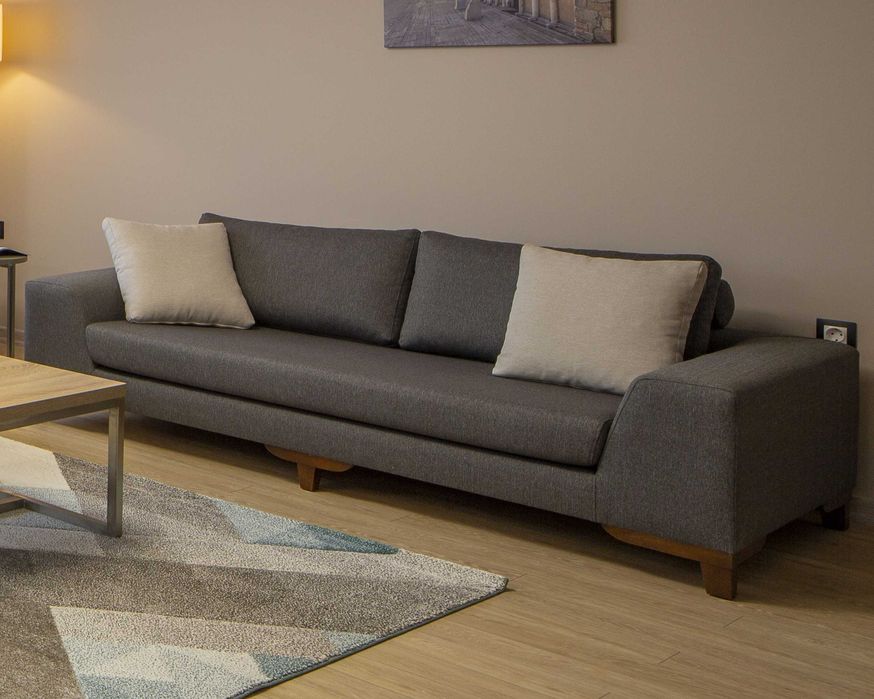 Комфортен и стилен тъмносив диван в отлично състояние, без разтягане