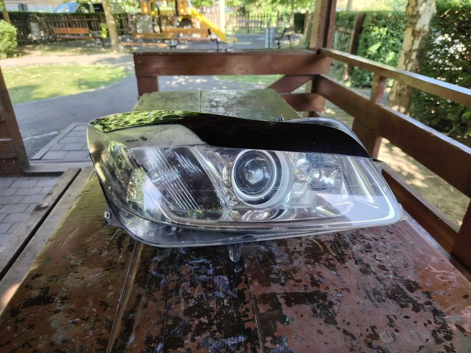 Faruri Opel insigna stânga dreapta,bi-xenon adaptabile după curbă 600 lei bucata