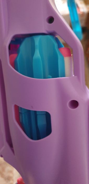 Toy  gun darts in stare perfect