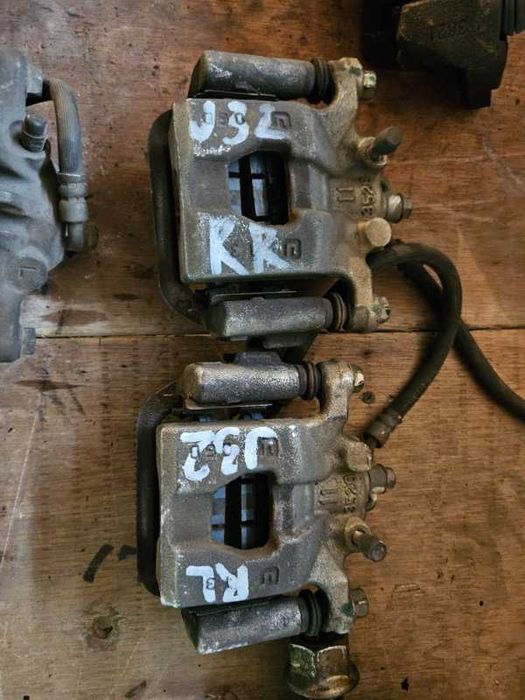 Суппорт тормозной Nissan Teana J32