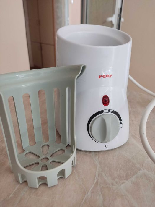 Уред за затопляне на шишета и бурканчета за бебешка храна