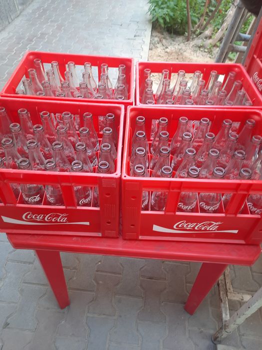 Кока-кола тара бор бутилкаси билан