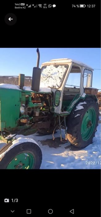 Трактор ЮМЗ с пресс подборшиком