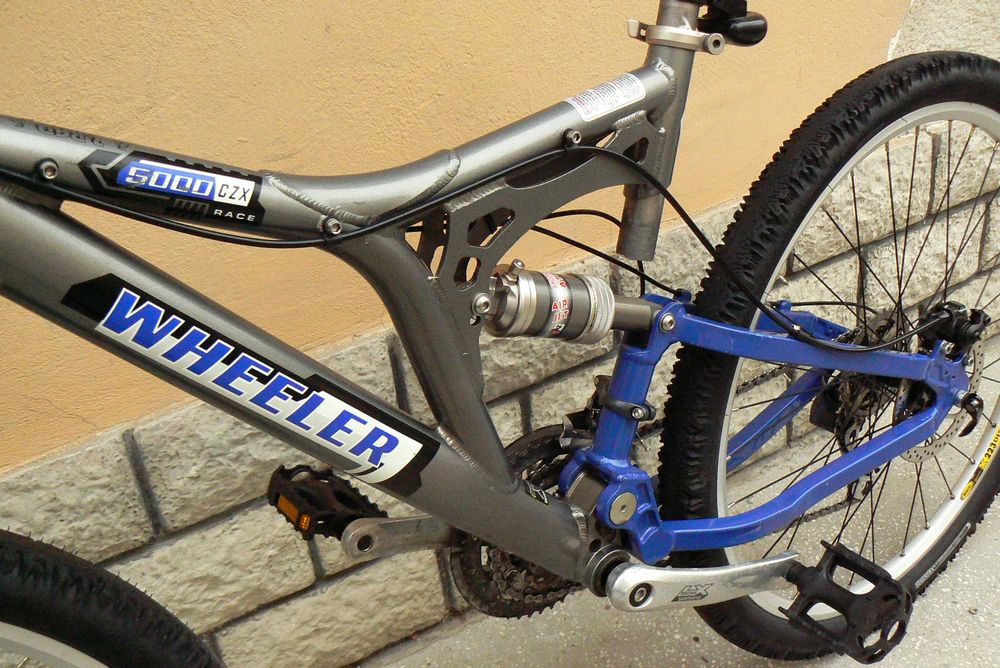 Bicicleta mountain bike de copii full suspensie Wheeler 26