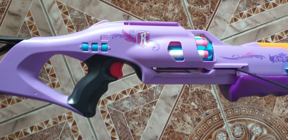 Toy  gun darts in stare perfect