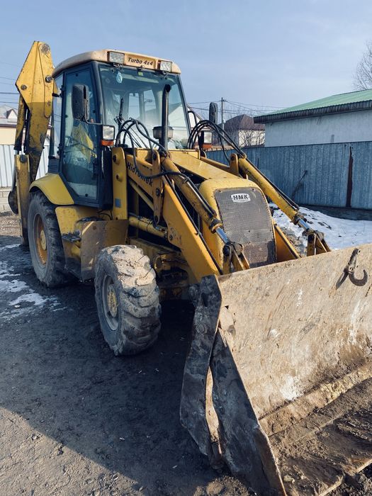 Услуги экскаватора-погрузчика