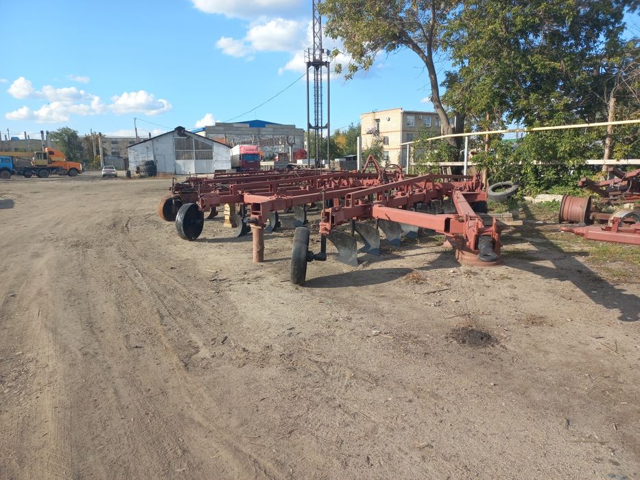 Плуг 9корпусный прицепной