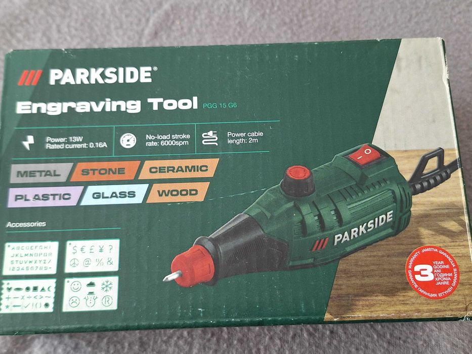 Aparat de gravură Parkside (model PGG 15 G6), destinată gravării pe diverse materiale precum metal, piatră, ceramică, plastic, sticlă și lemn