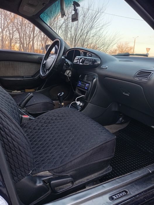 Мазда кседос 6 .