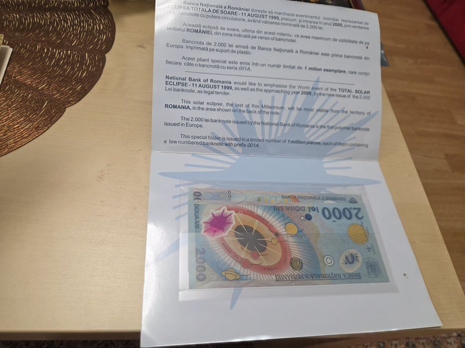 Bancnota de eclipsa  2000 cu seria 001A  și monede