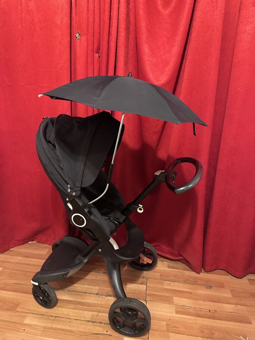 Carucior Stokke stare excelenta umbrela si geanta negru