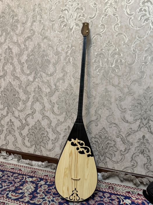 күмбірлеген Домбыра