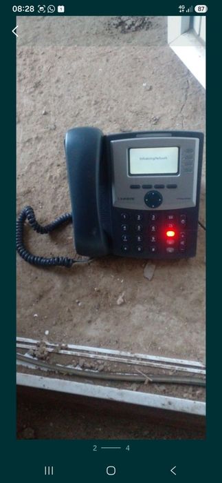 Телефон Linksys.