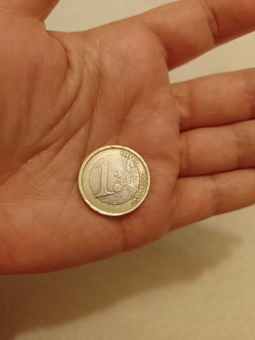 Moneda euro rara, de colecție, " Omul Vitruvian", 2002, preț 3000 lei.