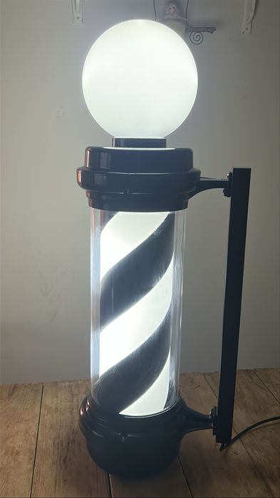 Въртящ се светещ бръснарски стълб.Barber  pole