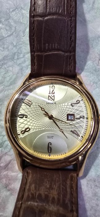 Золотые часы Ника