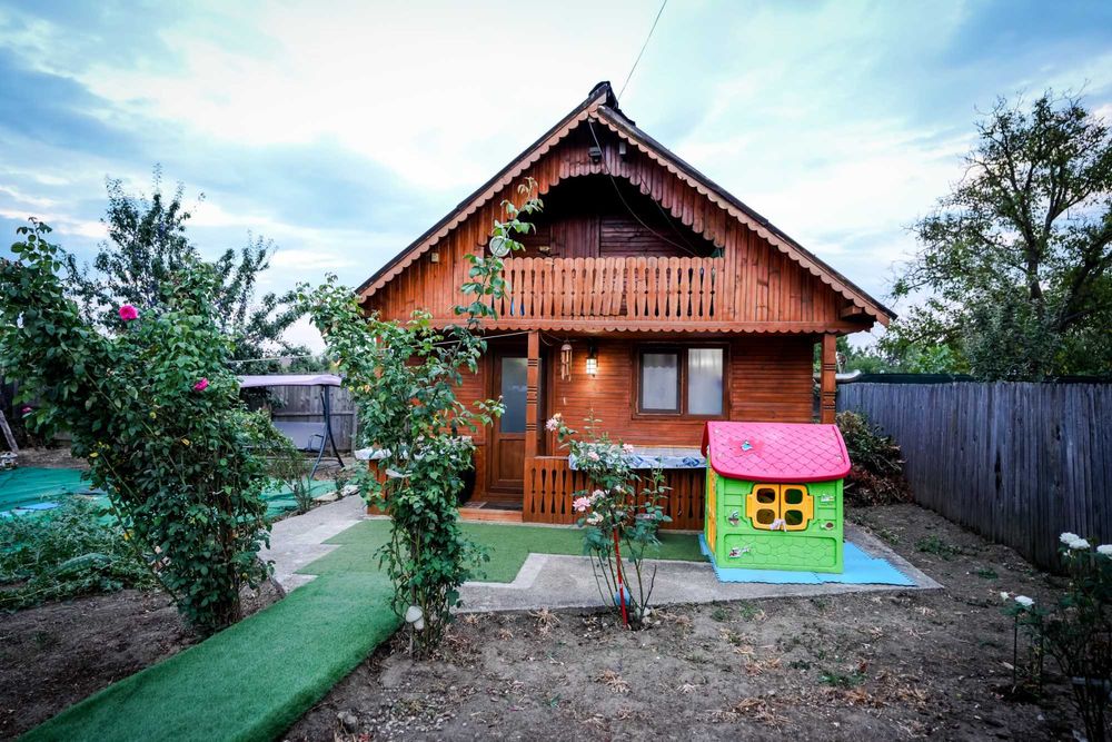 Cabana din lemn cu teren in Bascov