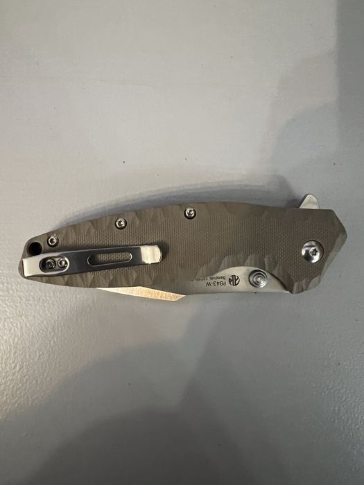 Briceag Ruike Otel inoxidabil 12C27, maner din G10