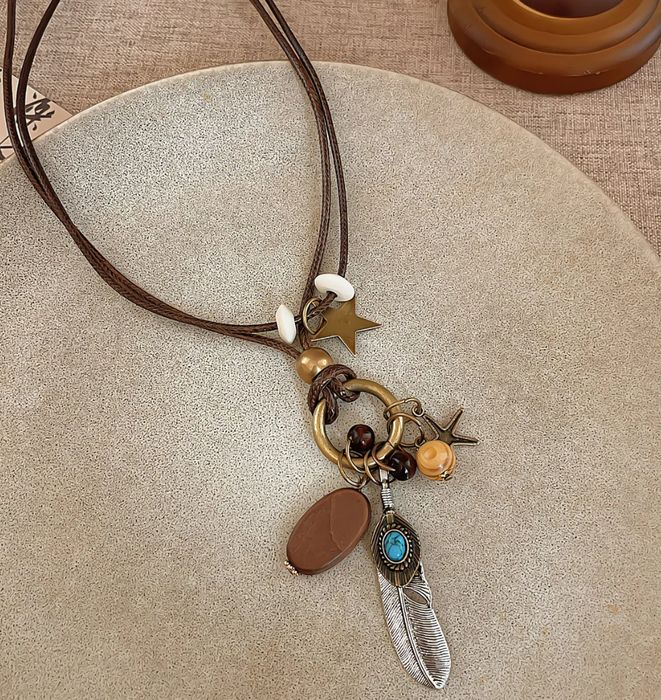 Подвеска с пером и звездочкой