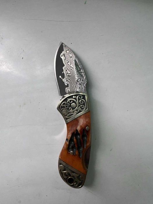 Damashq po'latidan yasalgan yig'ma pichoq