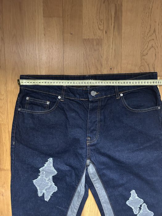 Blugi MAN cu design patchwork și tiv franjurat – stil urban original