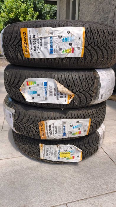 Anvelope NOI + capace NOI pentru FIAT PUNTO + jante tabla R14