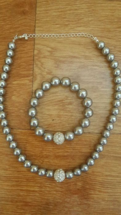 Новый комплект ожерелье с браслетом.