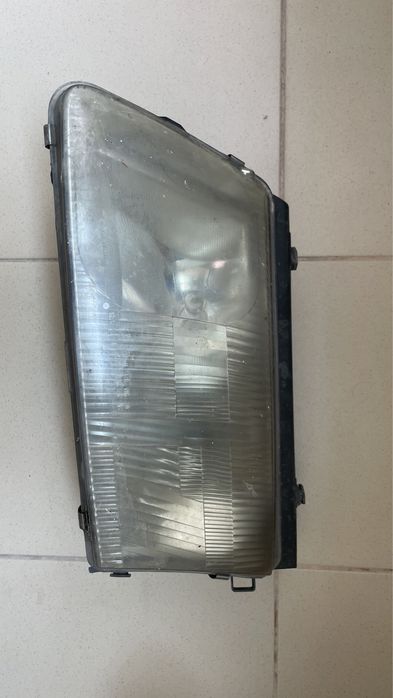 Оригинален Ляв фар Hella за Volkswagen Passat B5