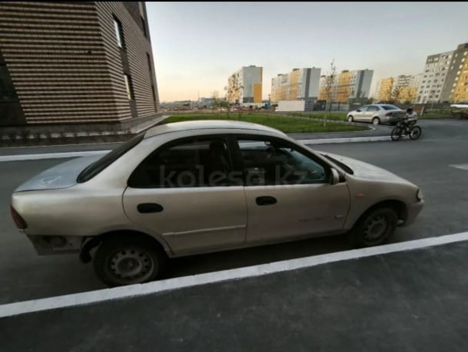 Продав автомобиль Mazda 323ba94  1.3