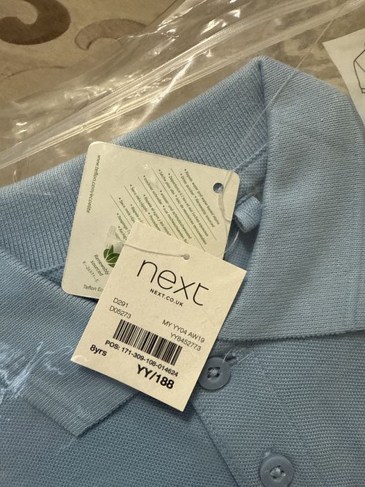 Продам поло next  на 8 лет.