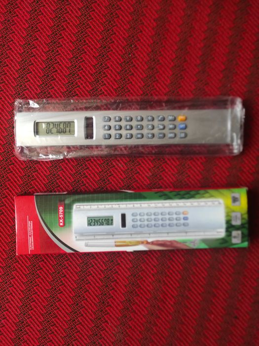 Calculator electronic cu fotocelulă și riglă în centimetri și inch