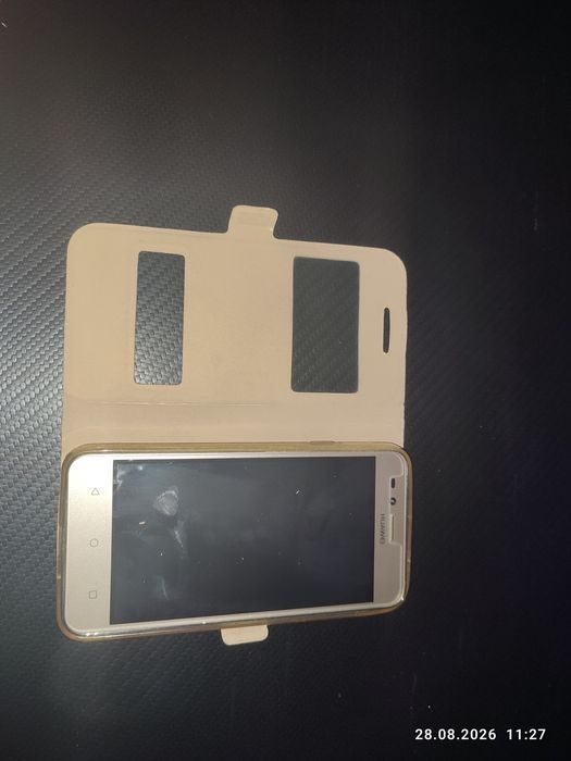 Продам Huawei LUA-U22, б/у + Чехол книжка