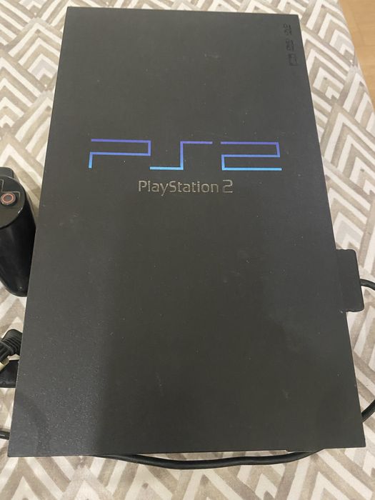 Vând PS2 în conditii bune